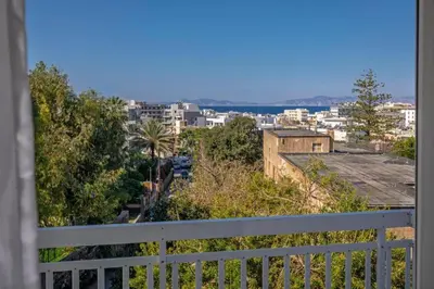a view of a city from a balcony at 4. Sea view luxury suite for 4 in Rhodes centre! in Rhodes Town