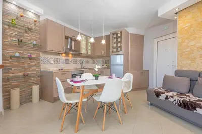 a kitchen and dining room with a table and chairs at 4. Sea view luxury suite for 4 in Rhodes centre! in Rhodes Town
