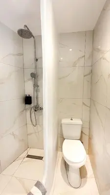 a white bathroom with a toilet and a shower at LA Casa Di Lusso N5 - Adults Only in Kolimbia