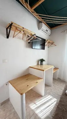 a room with a wooden table and a desk at LA Casa Di Lusso N5 - Adults Only in Kolimbia