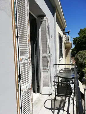 a table and chairs on the balcony of a building at CASA DE MIKEL 2 in Rhodes Town