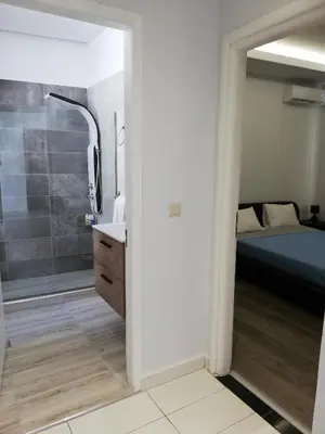a bathroom with a bed and a shower and a sink at CASA DE MIKEL 2 in Rhodes Town