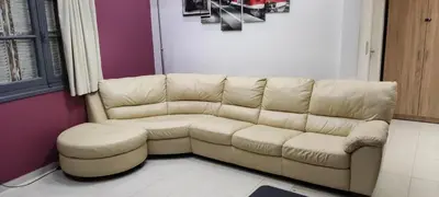 a living room with a couch and a table at CASA DE MIKEL 2 in Rhodes Town