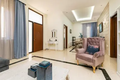 a living room with a chair and a couch at La Casa di Efi in Rhodes Town