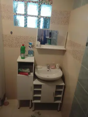 a small bathroom with a sink and a window at Home sweet home in Rhodes Town