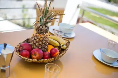 a basket of fruit sitting on a table at Kelly's Beach House 1 in Gennadi