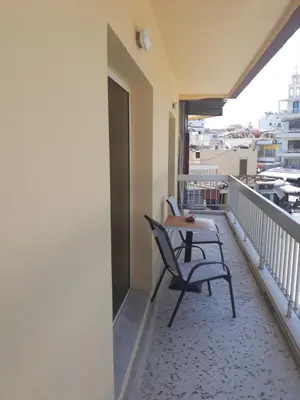 a balcony with two chairs and a table at AS SUITES ROOM 14 in Rhodes Town