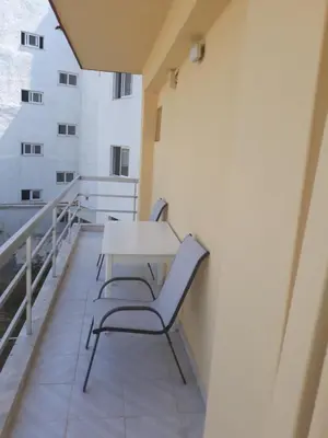 a balcony with a table and chairs on a building at AS SUITES ROOM 14 in Rhodes Town