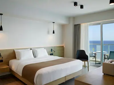 a hotel room with a bed and a balcony at Aquarium View Hotel in Rhodes Town
