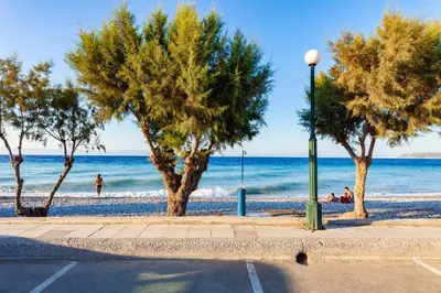 a street light and trees on the beach at CHAMBRE BLEUE in Ialyssos