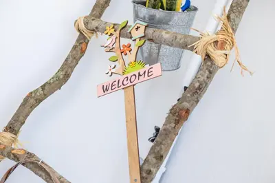 a wooden cross with a welcome sign on it at Kampus Living Luxury Complex in Faliraki