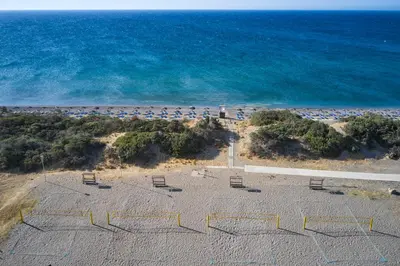 an overhead view of a beach with chairs and the ocean at Atlantica Plimmiri in Plimmiri