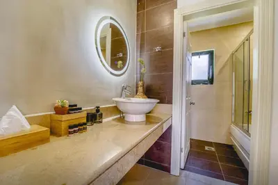 a bathroom with a sink and a mirror at Heliophos Villa Amalthia in Kiotari