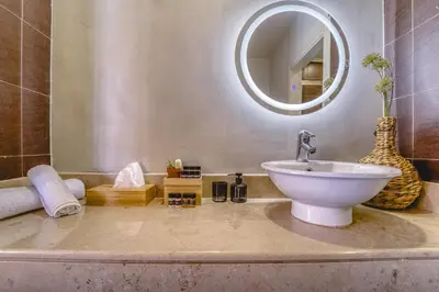 a bathroom with a sink and a mirror at Heliophos Villa Amalthia in Kiotari