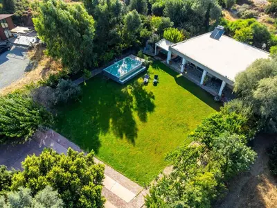 an aerial view of a house with a swimming pool at Heliophos Villa Aitheria in Kiotari