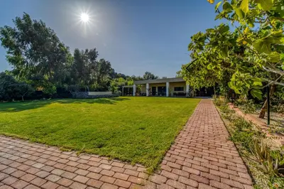 a brick walkway in front of a house at Heliophos Villa Aitheria in Kiotari
