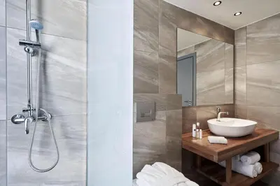 a bathroom with a sink and a shower at Luxury Rhodes Villa Amina Villa Sea View Private Swimming Pool in Rhodes Town