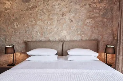a bedroom with a bed with two pillows at Luxury Rhodes Villa Amina Villa Sea View Private Swimming Pool in Rhodes Town