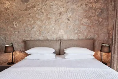 a bedroom with a bed with white pillows at Luxury Rhodes Villa Anissa Villa Sea View Private Swimming Pool in Rhodes Town
