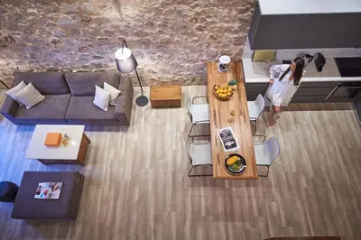 a woman standing in a living room with a table at Luxury Rhodes Villa Anissa Villa Sea View Private Swimming Pool in Rhodes Town