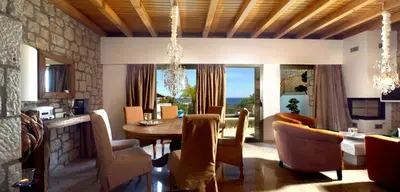 a dining room with a table and chairs and a dining room at Executive Rhodes Villa Villa Althea 2 Bedroom Villa With Sea Views Pefkos in Pefki Rhodes