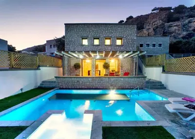a swimming pool in the backyard of a house at Executive Rhodes Villa Villa Ellie 2 Bedroom Villa With Sea Views Pefkos in Pefki Rhodes