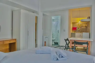 a bedroom with a bed with two towels on it at Gitonia Residence - Islander's Home Collection in Rhodes Town