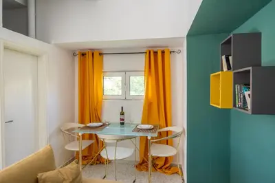 a small dining room with a table and chairs at Gitonia Residence - Islander's Home Collection in Rhodes Town