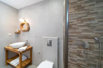 a bathroom with a sink and a shower at Serenity Villas in Kolimbia