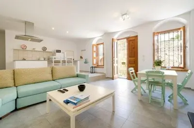 a living room with a couch and a table at Deluxe Rhodes Villa Villa Sokaki Well Furnished 2 Bedrooms in Líndos