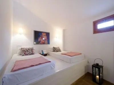 a bedroom with two beds and a window at Deluxe Rhodes Villa Villa Sokaki Well Furnished 2 Bedrooms in Líndos