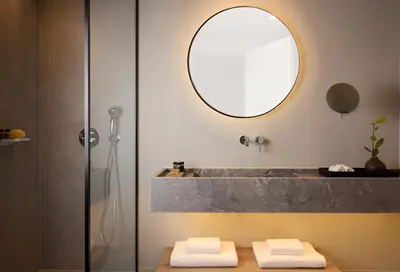 a bathroom with a sink and a tub with a mirror at Ella Elissa - Adults Only in Kallithea Rhodes