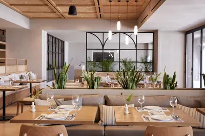 a dining room with tables and chairs and a restaurant at Ella Elissa - Adults Only in Kallithea Rhodes