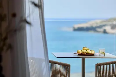 a plate of fruit on a table next to a window at Ella Elissa - Adults Only in Kallithea Rhodes