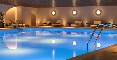 a pool in a hotel with chairs around it at Ella Helea in Kallithea Rhodes