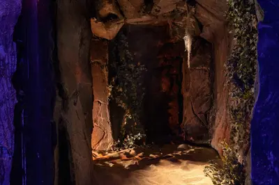 a cave filled with rocks and plants at Ella Helea in Kallithea Rhodes