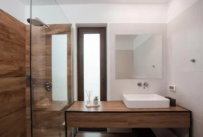 a bathroom with a white sink and a shower at Terra Pietra Luxury Villas & Suites in Lardos