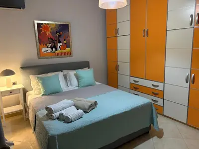 a bedroom with a bed with towels on it at Villa Vergio in Afantou