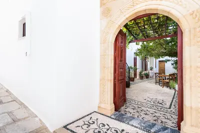 an entrance to a building with an archway at villa Zinovia in Líndos