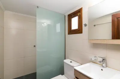 a bathroom with a toilet and a sink and a shower at villa Zinovia in Líndos