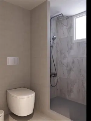 a bathroom with a toilet and a glass shower at Thalassa Luxury Studios Lindos in Líndos
