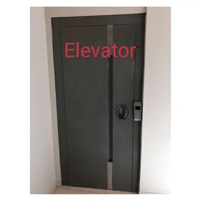 a elevator door with the word elevator on it at BLUE EYES APARTMENTS in Ixia