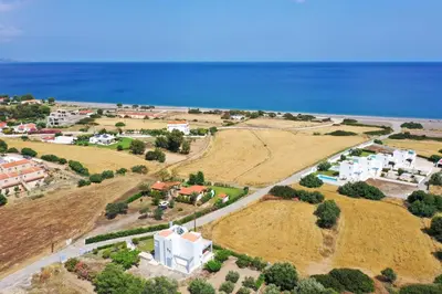 an aerial view of a small town near the ocean at Aelia Sea View Bungalow in Gennadi