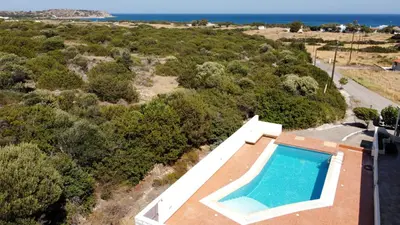 an aerial view of a villa with a swimming pool at Villa Stamos with Seaview and Private Pool - Partner of Prasonisi Villas in Plimmiri