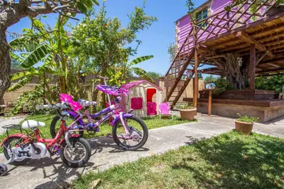 a couple of bikes parked next to a house at Laylande House in Theologos