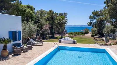 a villa with a swimming pool and a view of the ocean at Villa Blue Sapphire in Pefki Rhodes