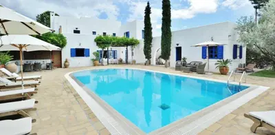 a swimming pool in front of a villa at Villa Blue Sapphire in Pefki Rhodes
