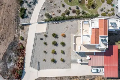 an overhead view of a building with a yard at Kelly's Beach House 2 in Gennadi