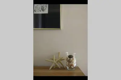 a glass vase sitting on a table next to a starfish at Villa Tsampika in Pefki Rhodes