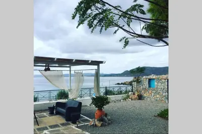 a patio with a view of the water at Villa Tsampika in Pefki Rhodes